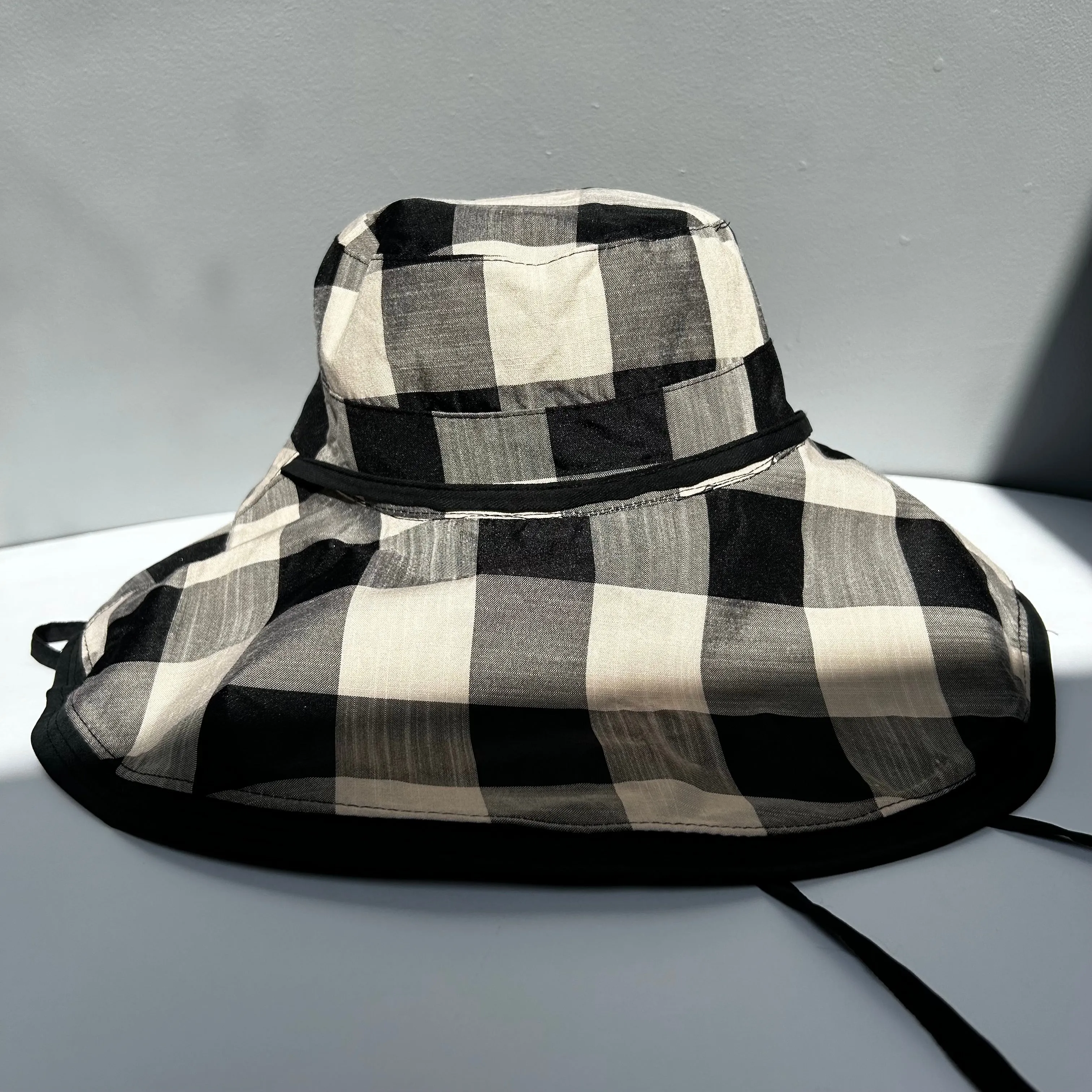 Wide brimmed reversible checked hats